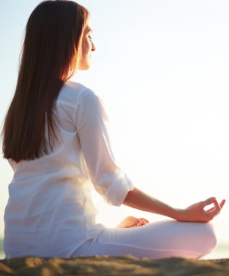 Woman meditating in a peaceful setting